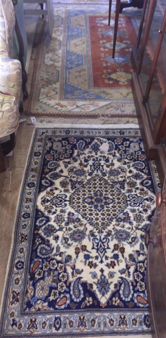 Oriental wool rug and a blue pattern rug